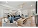 Open-concept living room with modern kitchen, stylish furnishings, and ample natural light at 1210 Skyview Rd, Charlotte, NC 28208