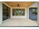 Covered patio featuring a stained wood ceiling, a ceiling fan, and expansive windows with black trim at 1210 Skyview Rd, Charlotte, NC 28208