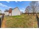 A large yard with privacy fence, garage and mature trees offering a sense of seclusion at 134 Falling Leaf Ln, Statesville, NC 28677