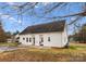 Backyard featuring a patio, new landscaping and a well maintained lawn at 134 Falling Leaf Ln, Statesville, NC 28677
