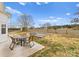 Inviting backyard featuring a patio set and a nice, ready-to-use firepit area to enjoy outdoors at 134 Falling Leaf Ln, Statesville, NC 28677