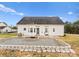A view of the backyard, showing a patio, landscaped stones and lawn at 134 Falling Leaf Ln, Statesville, NC 28677