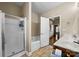 Spacious bathroom with a tiled floor, a shower, and a soaking tub at 134 Falling Leaf Ln, Statesville, NC 28677