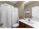 Bathroom featuring a vanity sink and shower with white curtain at 134 Falling Leaf Ln, Statesville, NC 28677