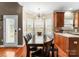 Elegant dining area with modern chandelier, bay window, and seamless flow to the kitchen at 134 Falling Leaf Ln, Statesville, NC 28677