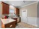 A kitchen view featuring wooden cabinets, tile floors and modern appliances at 134 Falling Leaf Ln, Statesville, NC 28677