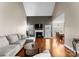 Bright living room with fireplace, modern lighting, and seamless flow to the dining area at 134 Falling Leaf Ln, Statesville, NC 28677