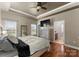 View of main bedroom with ceiling fan, tv and an ensuite bathroom at 134 Falling Leaf Ln, Statesville, NC 28677