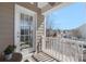 Cozy covered balcony with a wooden deck and white railing, providing a private outdoor space at 13925 Helen Benson Blvd, Davidson, NC 28036