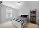 Bright bedroom features a white bed frame with black and white bedding and natural light at 13925 Helen Benson Blvd, Davidson, NC 28036