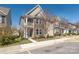 Charming two-story home with stone facade, a blue front door, and well-maintained landscaping at 13925 Helen Benson Blvd, Davidson, NC 28036