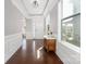 Welcoming foyer boasts hardwood floors, decorative trim, and plenty of natural light at 13925 Helen Benson Blvd, Davidson, NC 28036