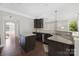 Kitchen with granite countertops, dark cabinetry, stainless steel appliances, and lots of natural light at 13925 Helen Benson Blvd, Davidson, NC 28036