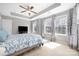 Large main bedroom with ceiling fan, plush carpet, and many bright windows at 13925 Helen Benson Blvd, Davidson, NC 28036