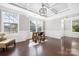 Bright office featuring hardwood floors, large windows, and decorative trim at 13925 Helen Benson Blvd, Davidson, NC 28036