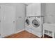 Bright laundry room features modern appliances, white cabinets, and a practical sink at 141 Planters Dr, Statesville, NC 28677