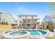 Inviting backyard showcases a pool, spa, deck with an outdoor living area and grill at 14130 Sunnyhill Grove Rd, Davidson, NC 28036