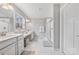 Stylish bathroom with double sinks and a glass enclosed shower at 14130 Sunnyhill Grove Rd, Davidson, NC 28036