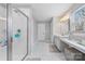 Bright bathroom with a vanity and glass door shower at 14130 Sunnyhill Grove Rd, Davidson, NC 28036