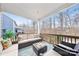 Inviting covered deck with comfortable seating, outdoor ceiling and a view of the lush backyard at 14130 Sunnyhill Grove Rd, Davidson, NC 28036