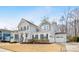 Charming two-story home with a well-manicured front yard, two car garage, and inviting entryway at 14130 Sunnyhill Grove Rd, Davidson, NC 28036