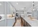 Well-equipped kitchen with a center island, stainless appliances, and white cabinetry at 14130 Sunnyhill Grove Rd, Davidson, NC 28036