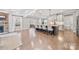 Open kitchen features a large island with seating, modern appliances, and hardwood floors at 14130 Sunnyhill Grove Rd, Davidson, NC 28036