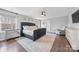 Inviting bedroom features a tufted bed, bedside tables, and modern decor at 14130 Sunnyhill Grove Rd, Davidson, NC 28036