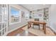 Bright office with built-in shelving, a large window, and a work desk with a patterned chair at 14130 Sunnyhill Grove Rd, Davidson, NC 28036