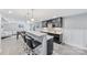 Entertain in style at this wet bar with quartz countertops, seating, and convenient access to the rec room at 14130 Sunnyhill Grove Rd, Davidson, NC 28036