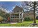 Exterior shot of the home showcasing the back porch, patio, and spacious backyard at 142 Mills Ln, Fort Mill, SC 29708