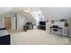 Large bedroom featuring an office area, neutral colors, natural light, ceiling fan, and multiple desks at 142 Mills Ln, Fort Mill, SC 29708