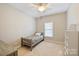 Cozy bedroom with neutral paint, natural light and a ceiling fan and twin bed, perfect for  at 142 Mills Ln, Fort Mill, SC 29708