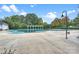 Community pool is covered for the off-season, surrounded by trees and foliage at 142 Mills Ln, Fort Mill, SC 29708