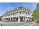 Attractive mixed-use building with white exterior, covered walkways, and dormer windows at 142 Mills Ln, Fort Mill, SC 29708