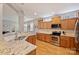 Kitchen featuring stainless steel appliances, granite countertops, wood cabinets, and a breakfast bar at 142 Mills Ln, Fort Mill, SC 29708