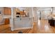 Open concept kitchen with granite counters, breakfast bar, stainless appliances, and hardwood flooring at 142 Mills Ln, Fort Mill, SC 29708