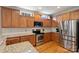 Bright kitchen showcasing granite countertops, stainless steel appliances, and ample cabinet space at 142 Mills Ln, Fort Mill, SC 29708