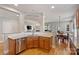 Open kitchen featuring granite counters, stainless steel appliances, and hardwood floors at 142 Mills Ln, Fort Mill, SC 29708