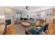 Bright, open living area with fireplace, comfortable seating, and hardwood floors at 142 Mills Ln, Fort Mill, SC 29708