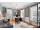 Stylish home office with hardwood floors, gray walls, and ample natural light at 142 Mills Ln, Fort Mill, SC 29708