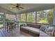 Inviting screened porch with a wood ceiling, comfortable seating, wood floors and a natural view at 142 Mills Ln, Fort Mill, SC 29708