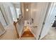 Wooden staircase with carpet runner leads to upper level at 142 Mills Ln, Fort Mill, SC 29708