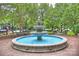 Beautiful town fountain with surrounding benches and lush greenery, perfect for relaxing at 142 Mills Ln, Fort Mill, SC 29708