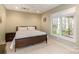 Bright bedroom with a large window and a comfortable queen-sized bed at 1426 Merrimont Ave, Kings Mountain, NC 28086