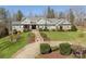 Well-manicured landscaping with stone steps lead up to the front door of this beautiful home at 1426 Merrimont Ave, Kings Mountain, NC 28086