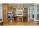 Gourmet kitchen featuring custom cabinetry, granite countertops, and a large island with bar seating at 1426 Merrimont Ave, Kings Mountain, NC 28086