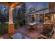 Covered back patio shows outdoor kitchen, built-in grill and table with seating at 1426 Merrimont Ave, Kings Mountain, NC 28086