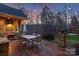 Outdoor dining patio featuring string lights for evening enjoyment at 1426 Merrimont Ave, Kings Mountain, NC 28086