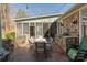 Stone patio shows outdoor kitchen with built-in grill and outdoor seating at 1426 Merrimont Ave, Kings Mountain, NC 28086